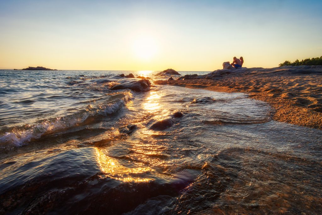 Two people watching a sunset in Greece