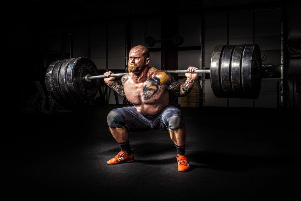 A man squatting with a barbell