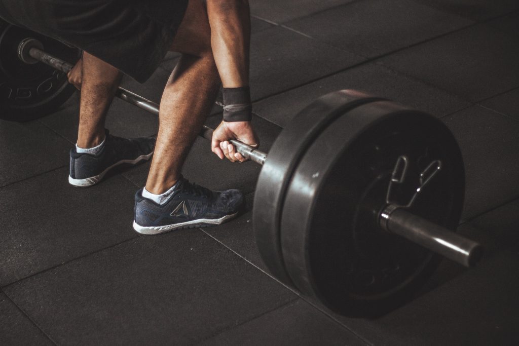 Man performing a deadlift to illustrate velocity based-training